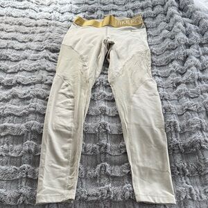 Nike Pro Women’s Cream Joggers with Gold/Silver lines